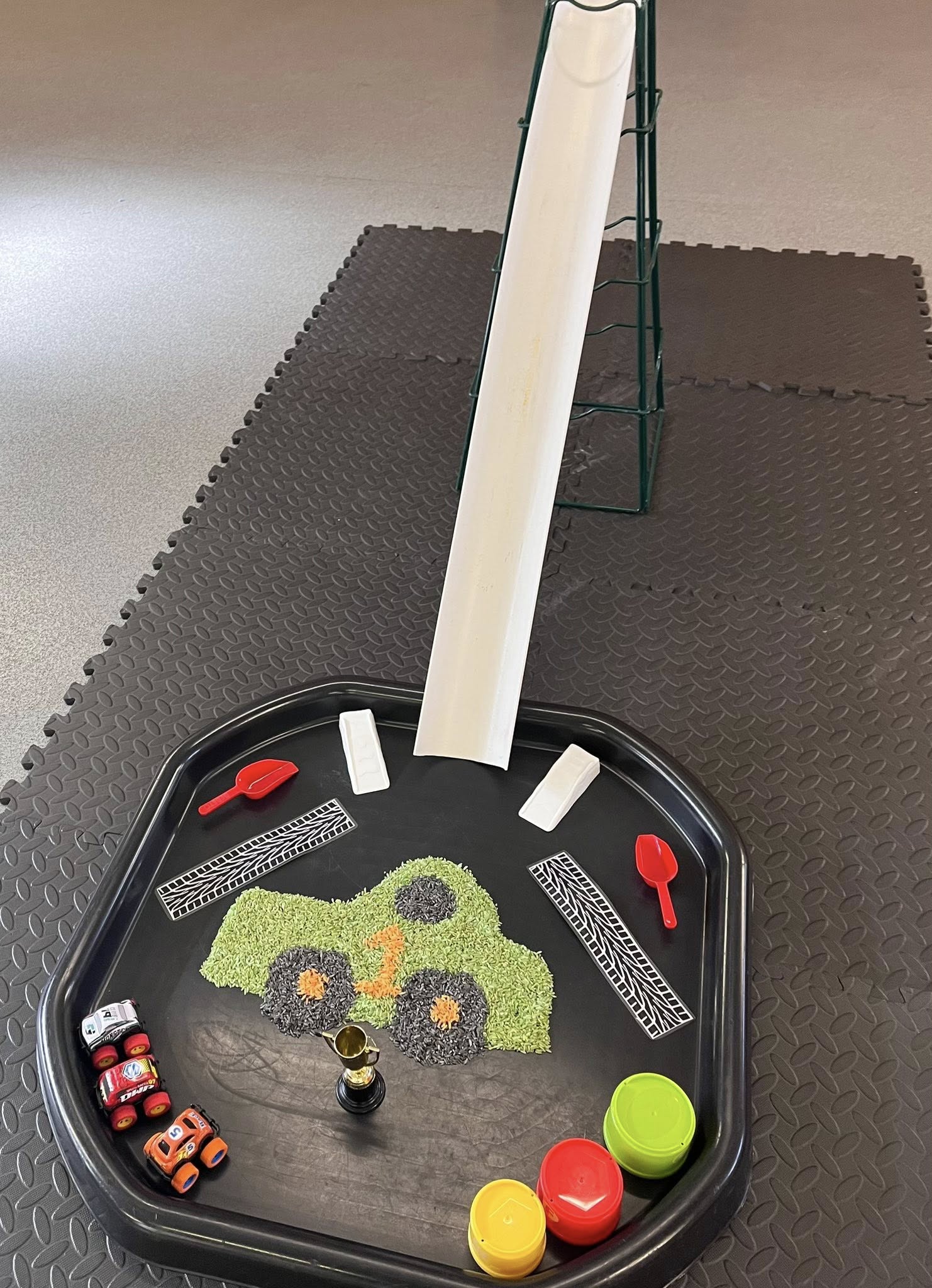 Child painting with bright colours