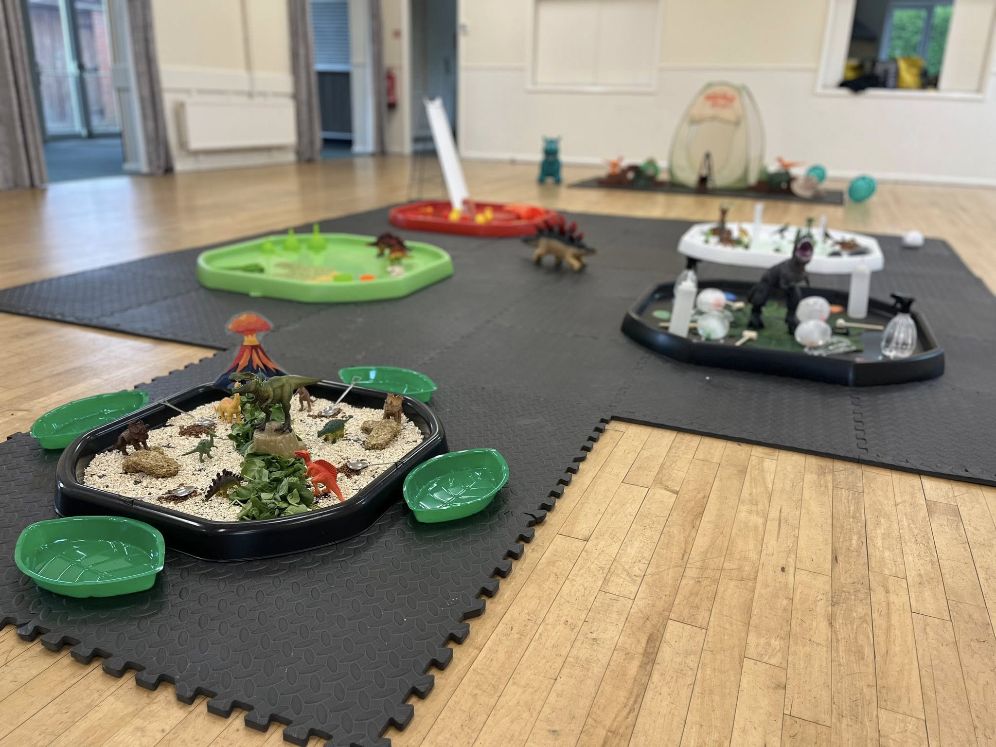 Child painting with bright colours